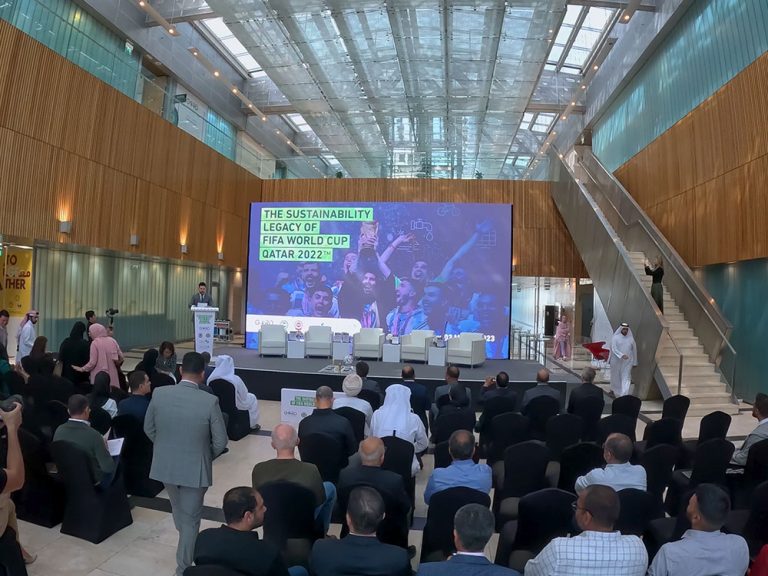 A GORD Advisory team member delivering a talk at a Qatar 2022 World Cup sustainability session, emphasizing carbon reduction initiatives.